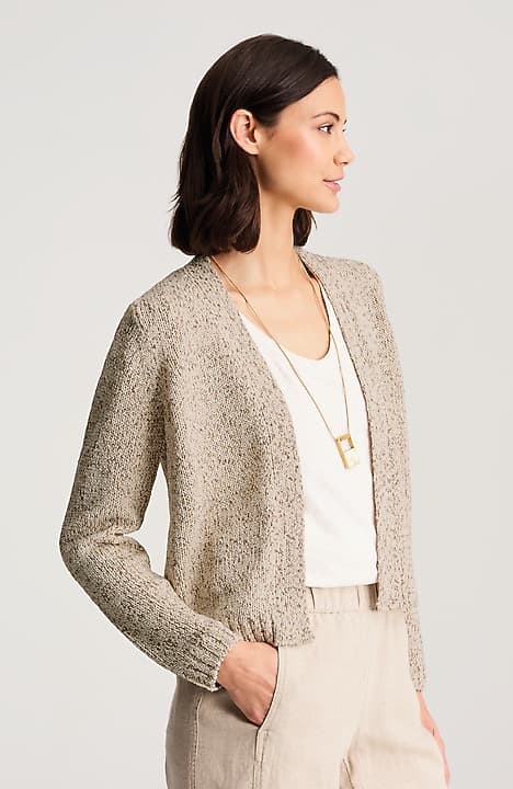 Help with style: a beige textured knit cardigan over a white top