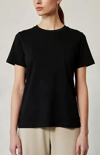 3-Classic-T-shirt - Style Fix Studio Front view of a person wearing a plain black short-sleeve T-shirt and beige pants.