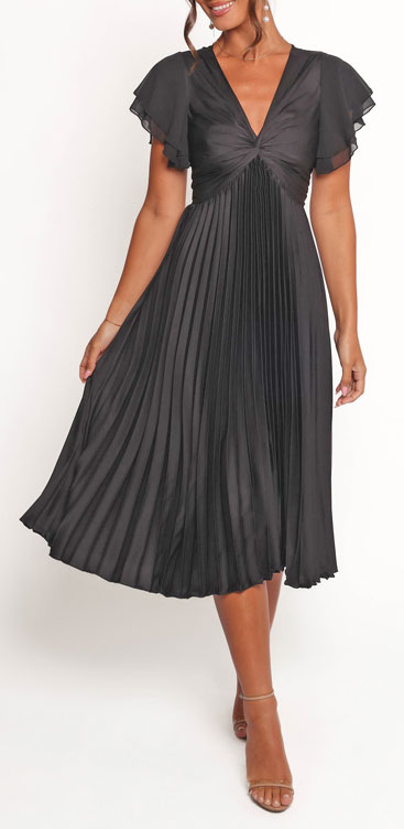 2A-Pear-Shape-1A - Style Fix Studio Black pleated midi dress with a ruched V-neck bodice and flutter sleeves on a model.